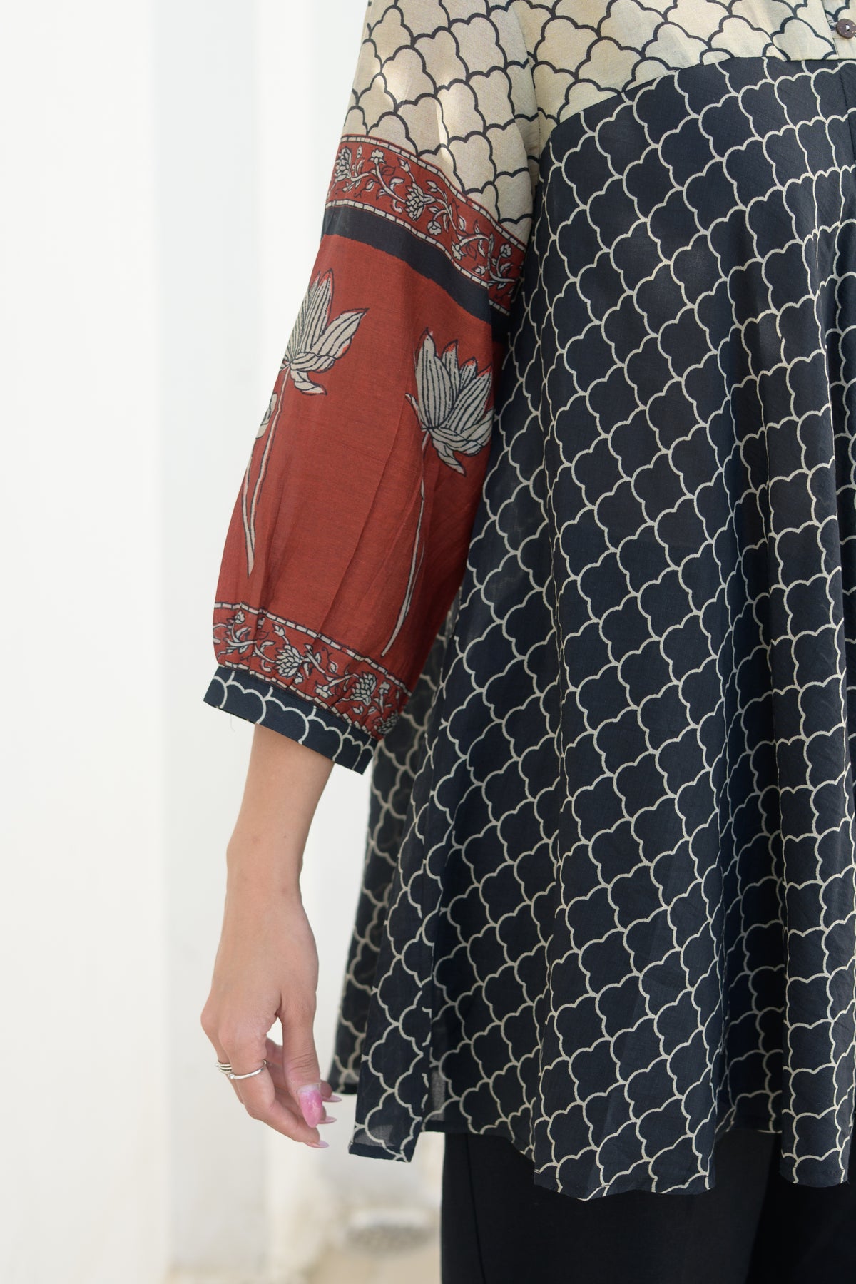 Black & Rust Jaal Print Peplum Top with Lotus Sleeves