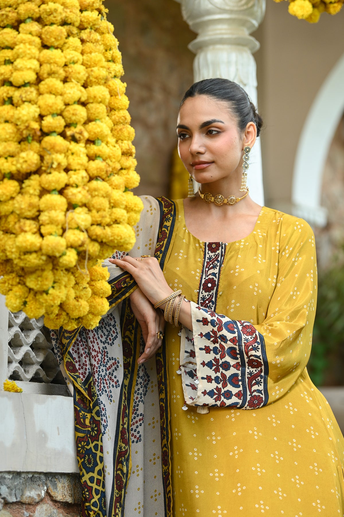 Mustard and blue ajrakh print sequence work A line suit set with chinnon ajrakh print dupatta