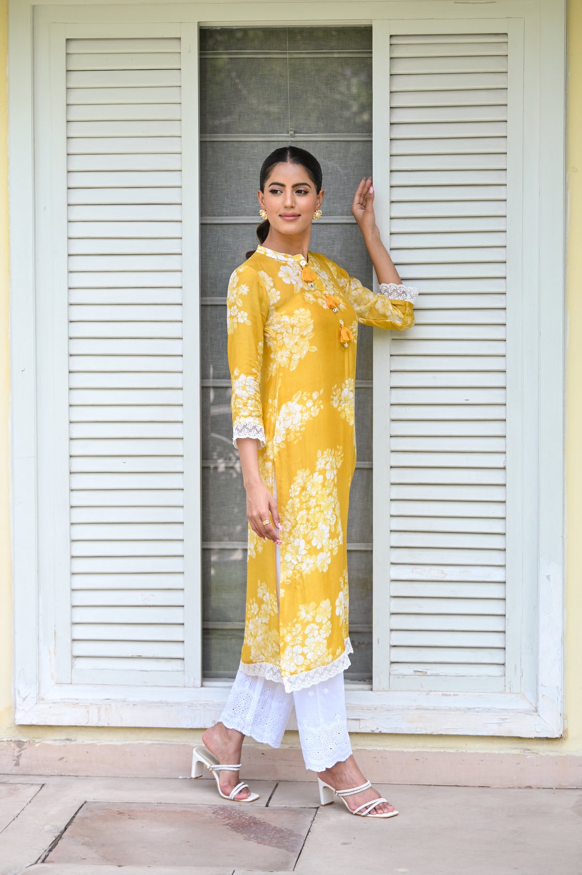 Kiara Advani in Yellow Bloom Muslin Kurti with Alluring lace and Schiffli pants