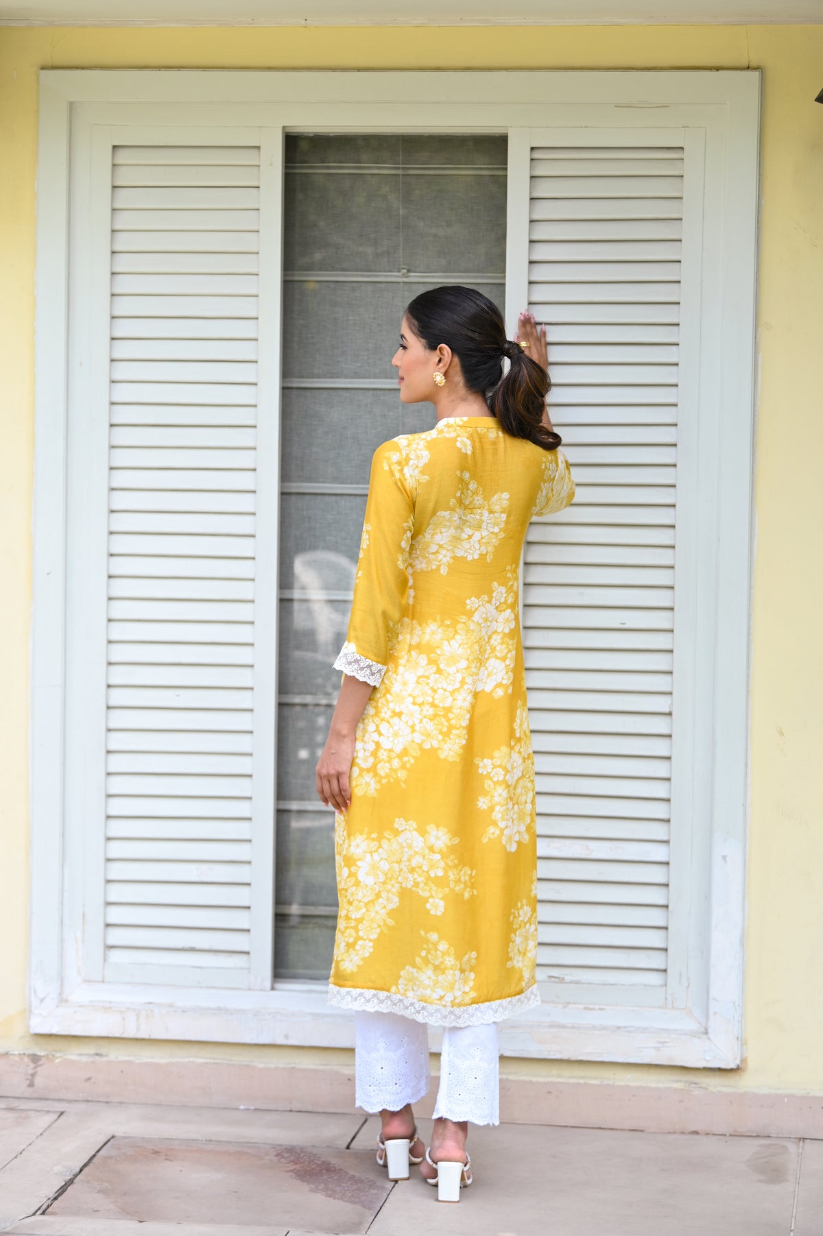 Kiara Advani in Yellow Bloom Muslin Kurti with Alluring lace and Schiffli pants