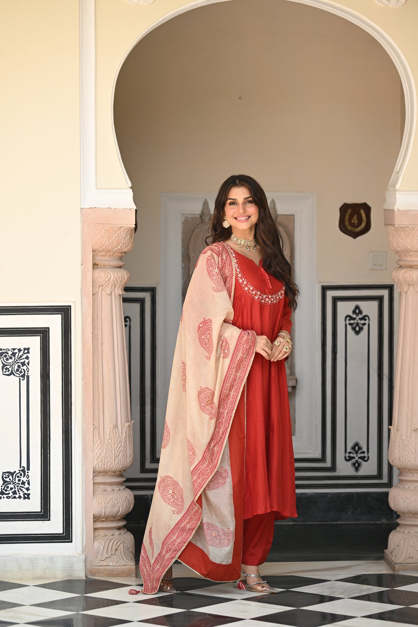 Rustic reddish mul chanderi suit set with beads and tari work on neck and block paisley with spread gota work dupatta