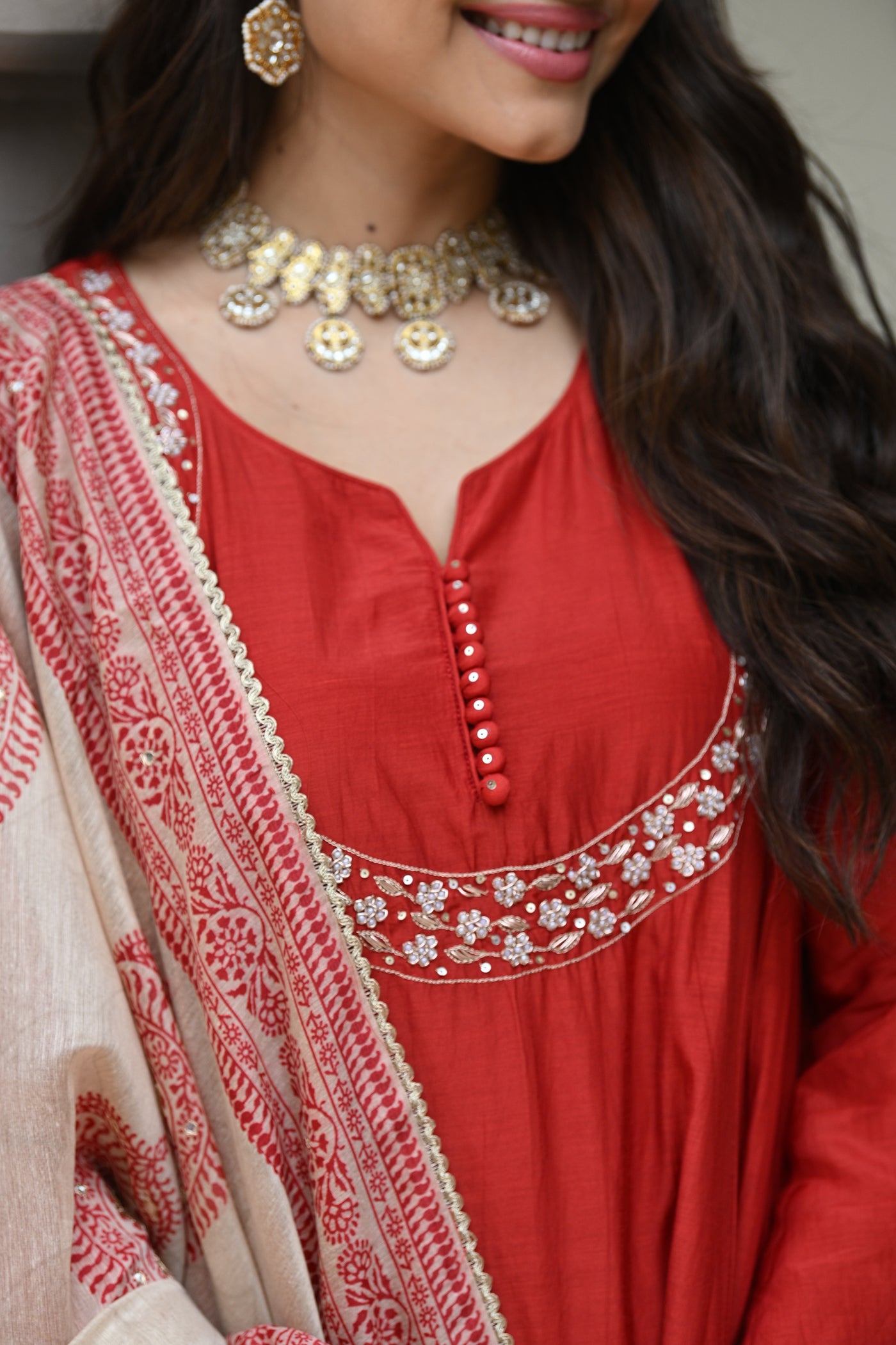 Rustic reddish mul chanderi suit set with beads and tari work on neck and block paisley with spread gota work dupatta